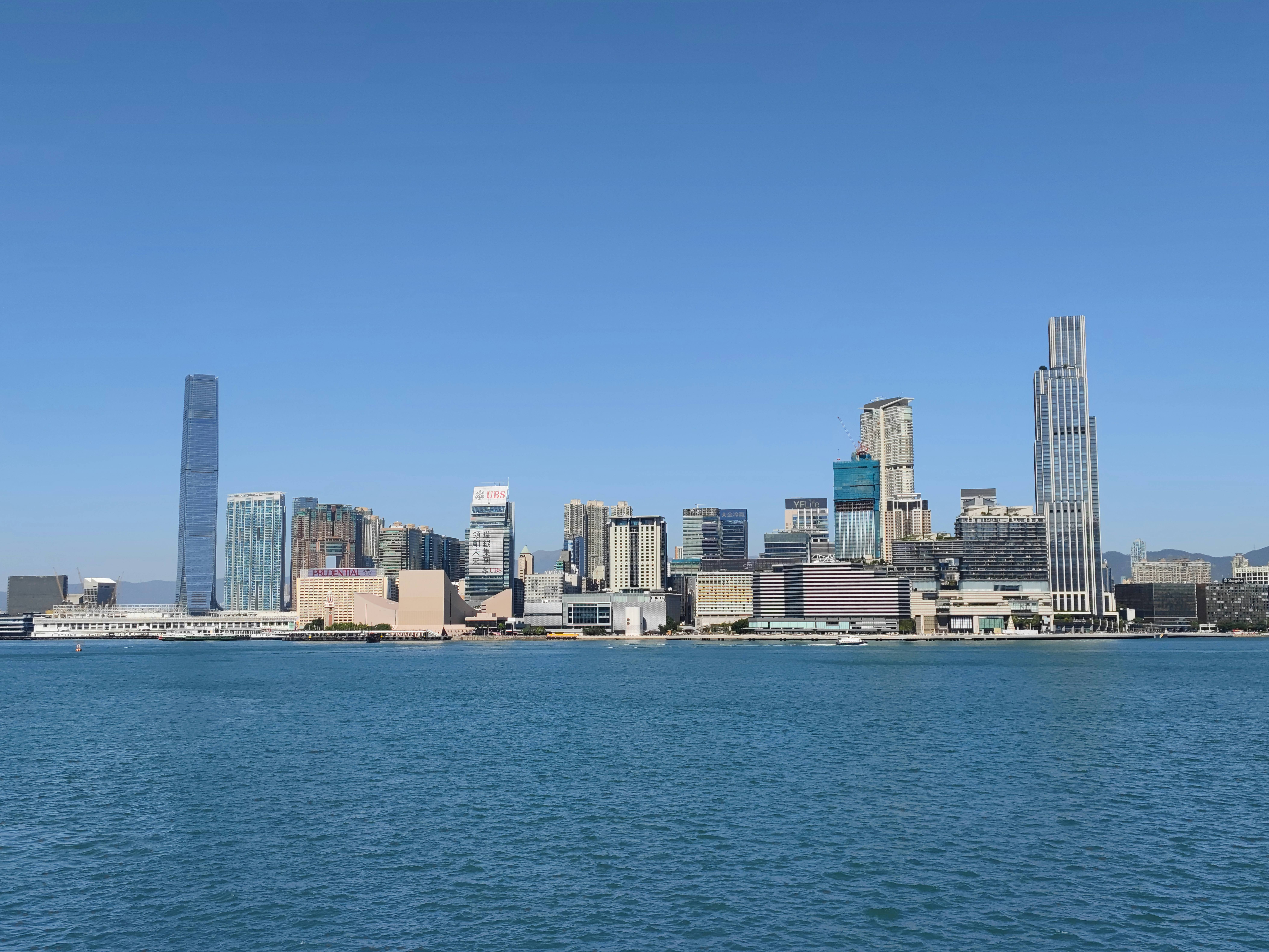 a large body of water with a city in the background